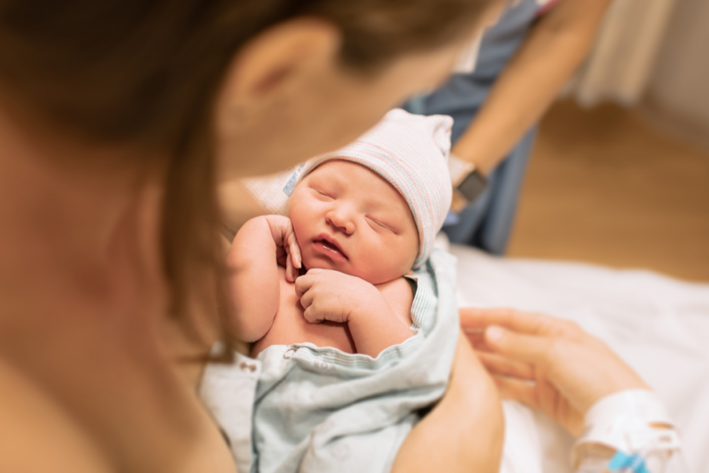 A parent holding a newborn.