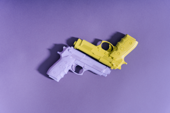 A purple and an yellow gun.