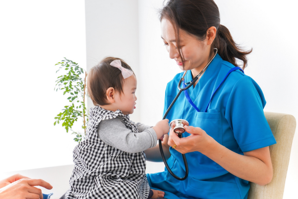 A pediatrician checking a baby.