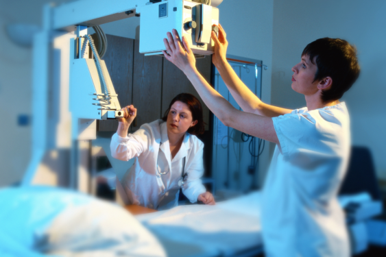 X-ray technician prepping the room to take an x-ray