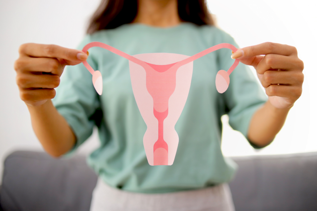 Woman holding uterus illustration