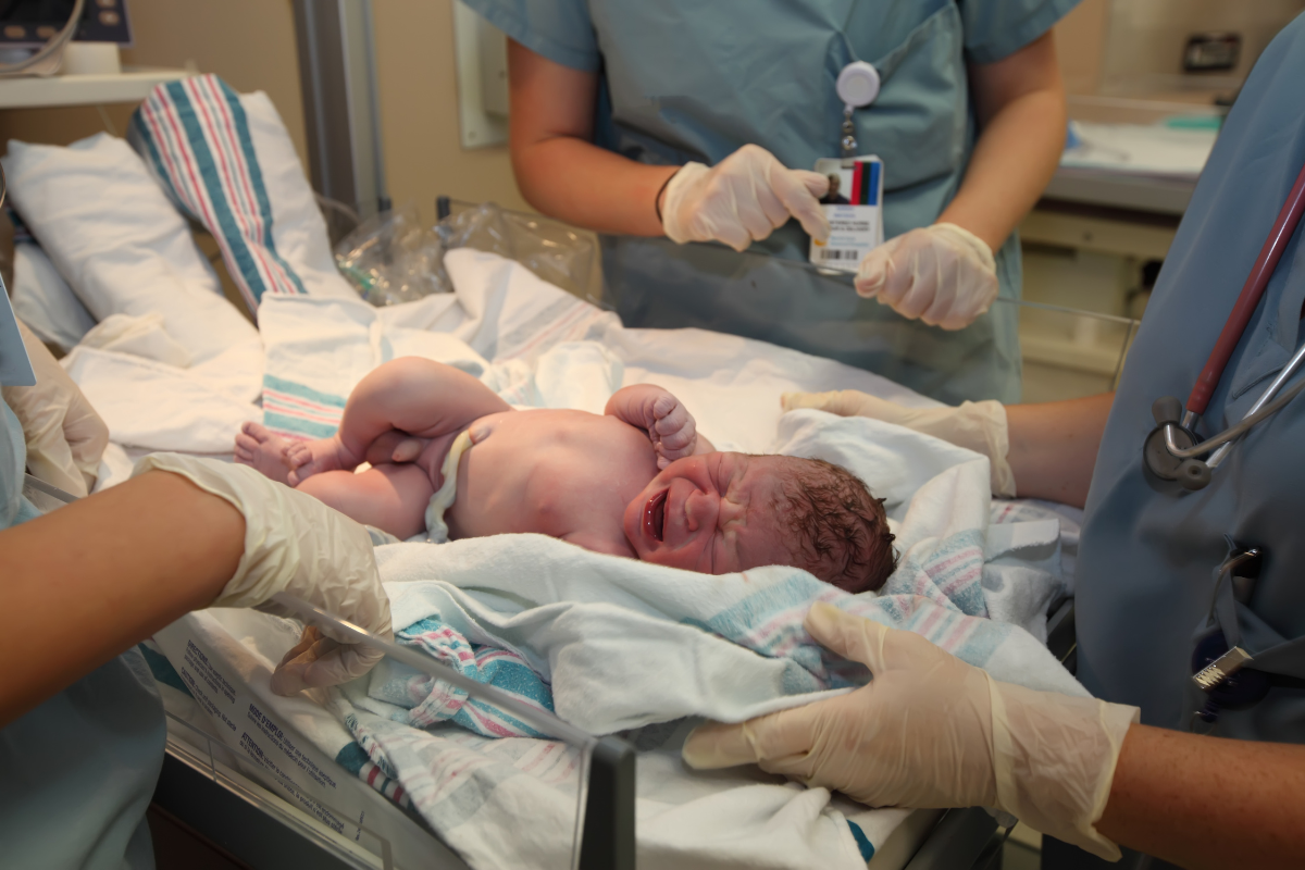 Newborn with umbilical cord