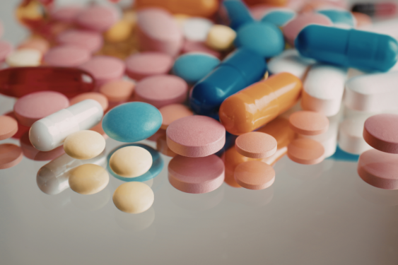 A variety of pills scattered on a surface