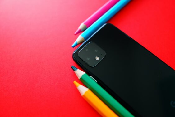 A phone with colored pencils